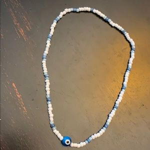 A stretchy stringed, beaded necklace